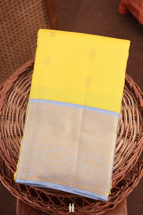 Kanchipuram Silk Saree In Yellow With Peacock Buttas