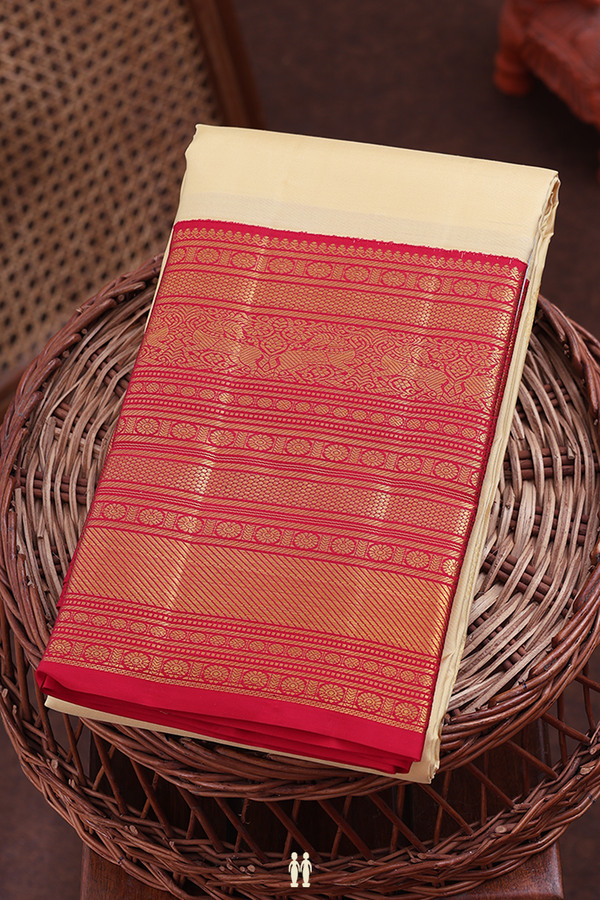 Kanchipuram Silk Saree In Cream Color With Paisley Buttas