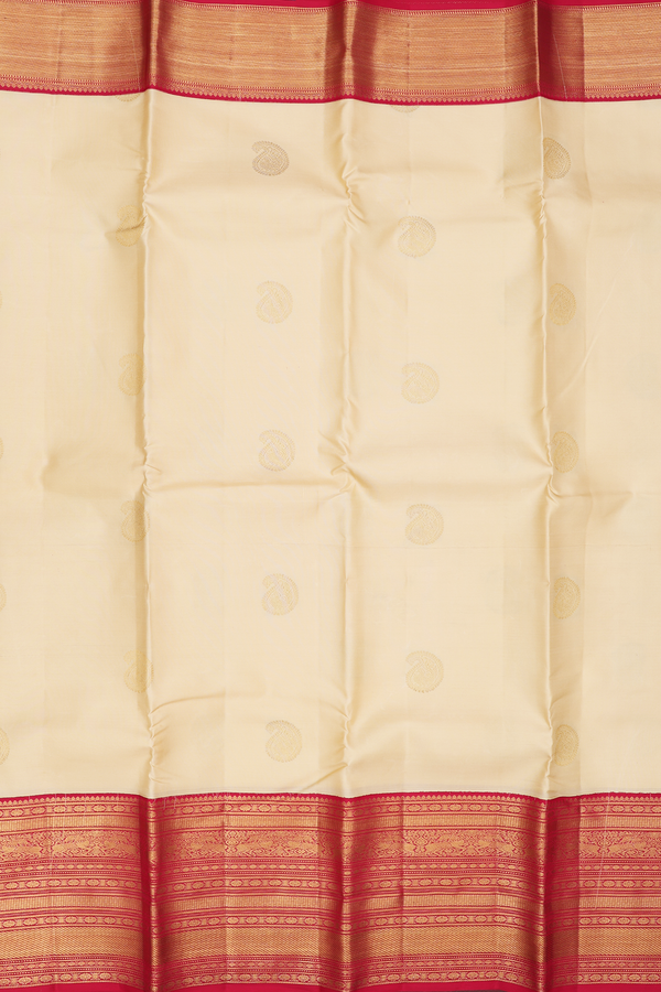 Kanchipuram Silk Saree In Cream Color With Paisley Buttas