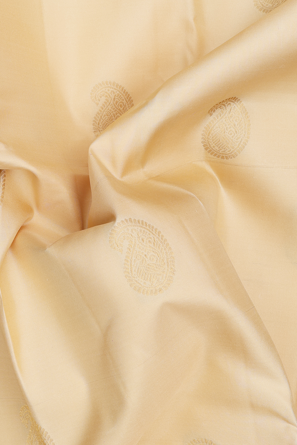 Kanchipuram Silk Saree In Cream Color With Paisley Buttas