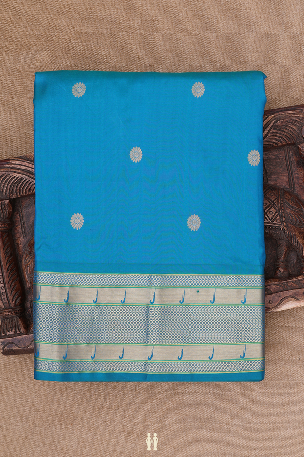 Paithani Silk Saree In Peacock Blue With Floral Buttas