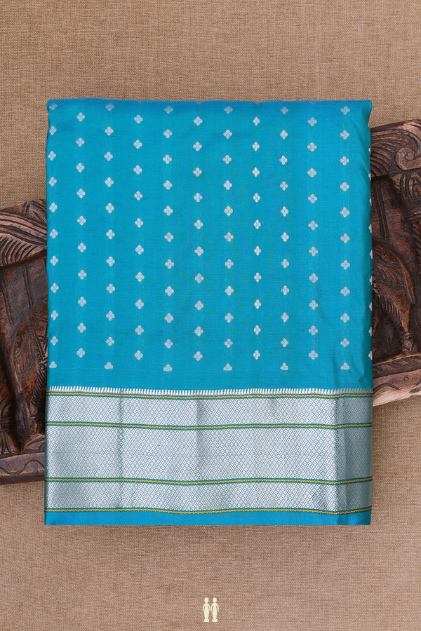 Paithani Silk Saree In Peacock Blue With Floral Buttis