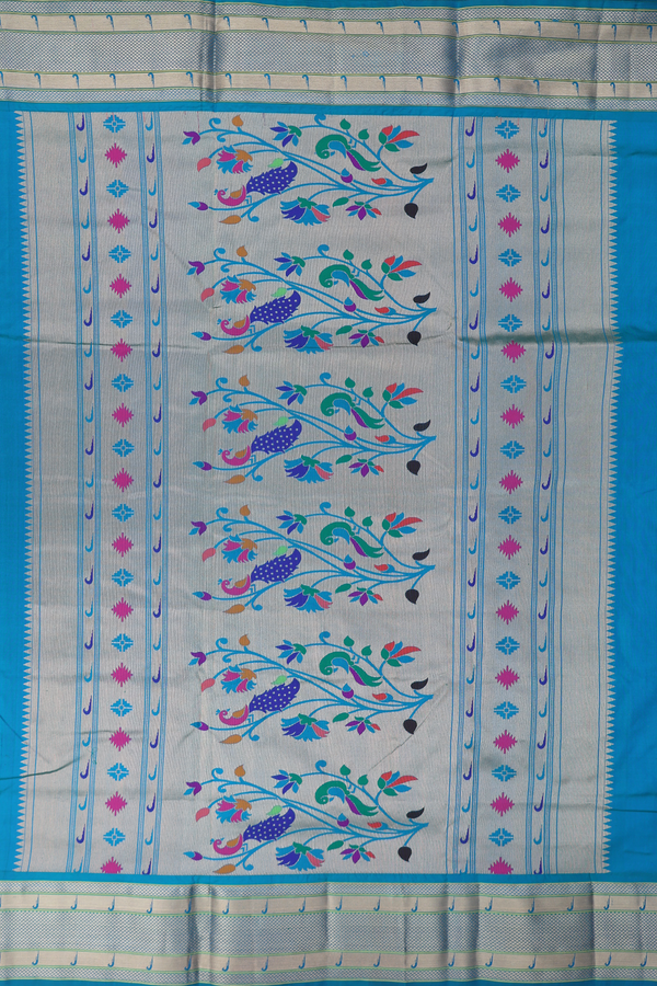 Paithani Silk Saree In Peacock Blue With Floral Buttas