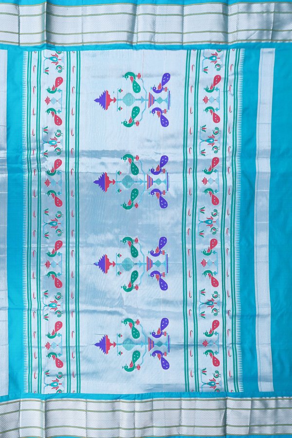 Paithani Silk Saree In Peacock Blue With Floral Buttis