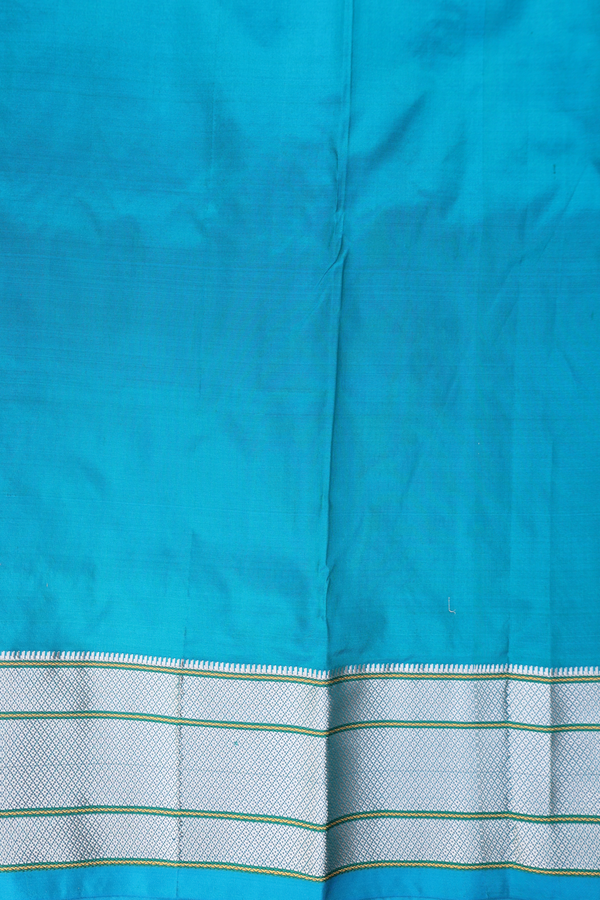 Paithani Silk Saree In Peacock Blue With Floral Buttis