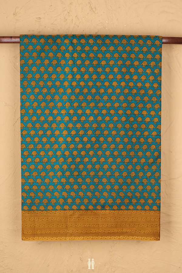 Printed Silk Saree In Peacock Green With Floral Buttas