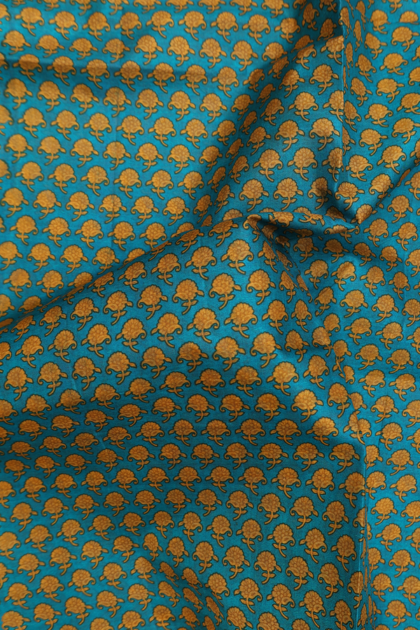 Printed Silk Saree In Peacock Green With Floral Buttas