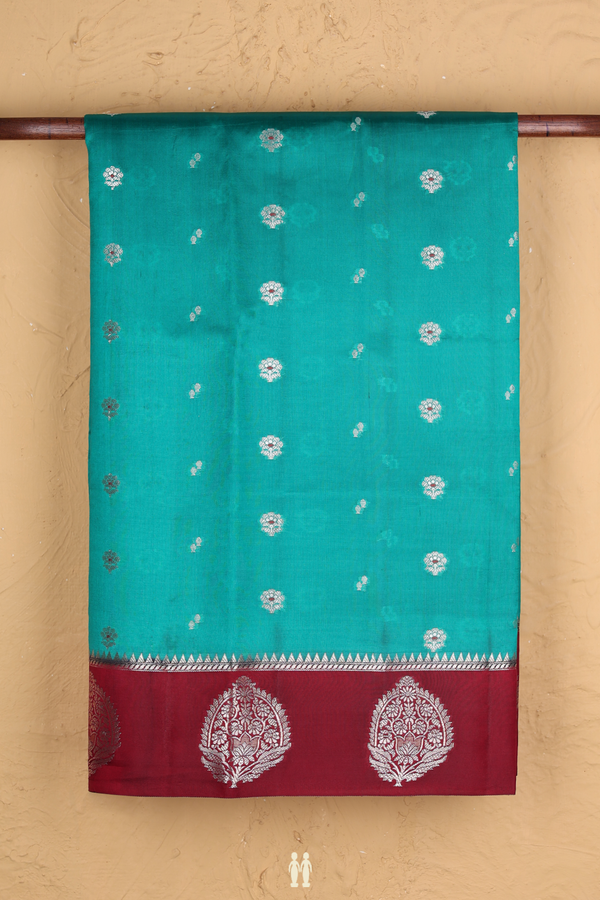 Raw Silk Saree In Green With Floral Buttas