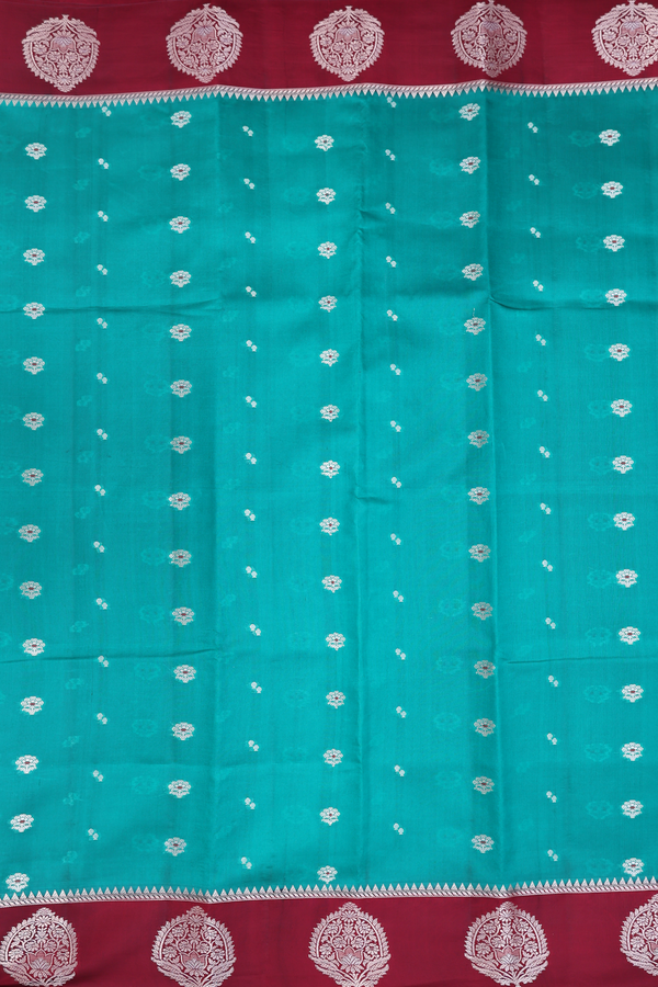 Raw Silk Saree In Green With Floral Buttas
