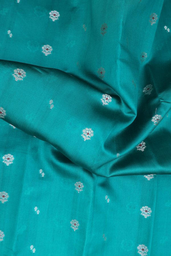 Raw Silk Saree In Green With Floral Buttas
