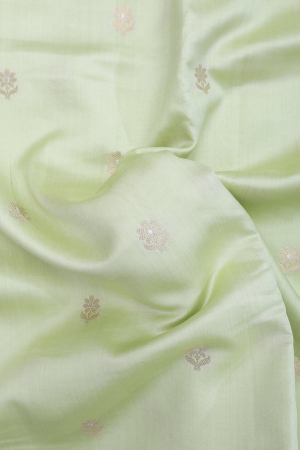 Raw Silk Saree In Pastel Green With Floral Buttas