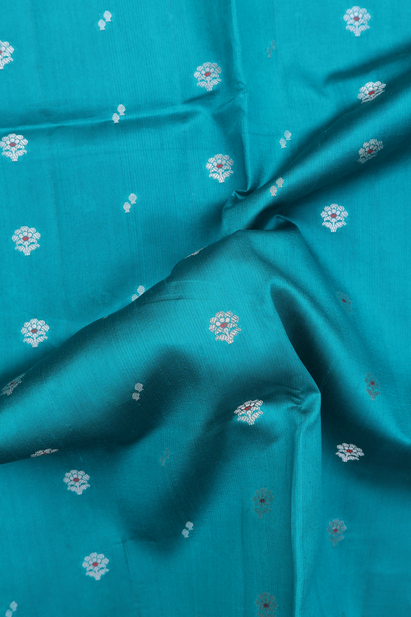 Raw Silk Saree In Peacock Green With Floral Buttas