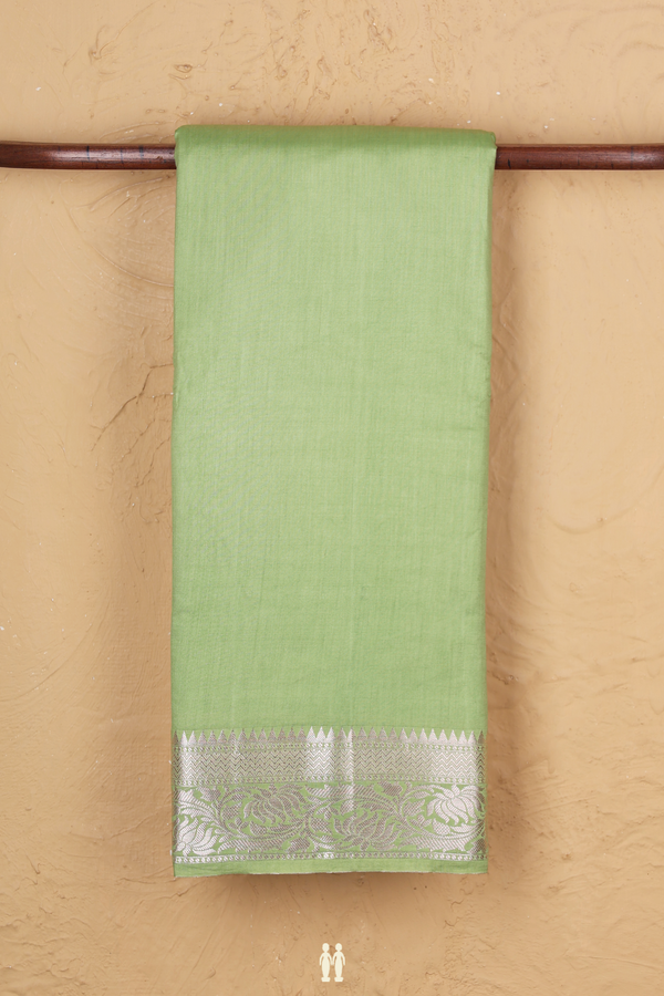 Raw Silk Saree In Plain Pastel Green With Floral Border