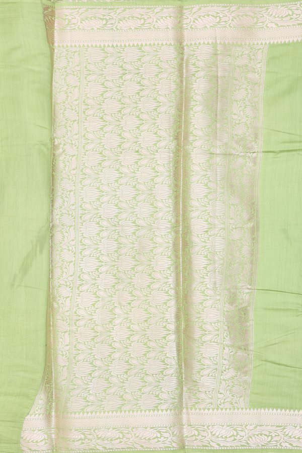 Raw Silk Saree In Plain Pastel Green With Floral Border