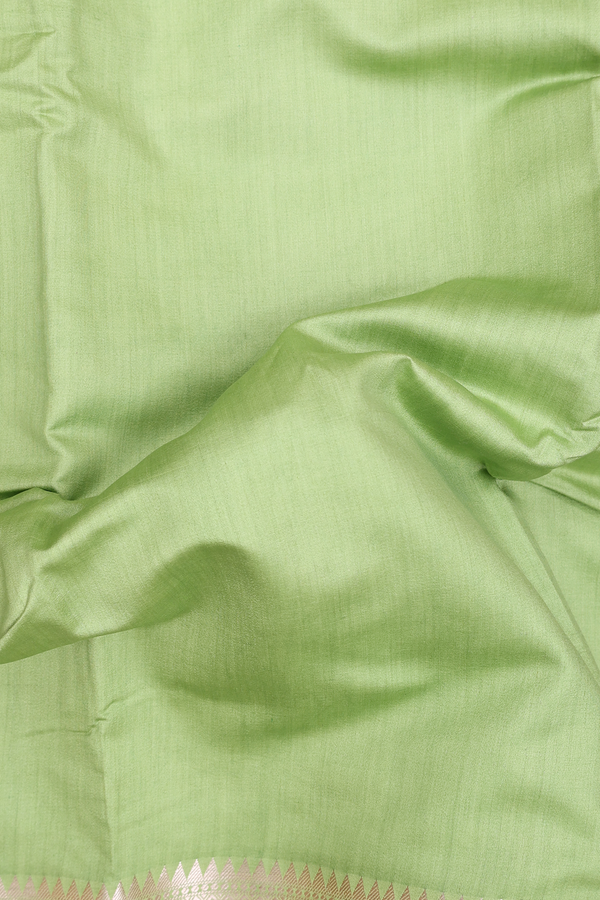 Raw Silk Saree In Plain Pastel Green With Floral Border