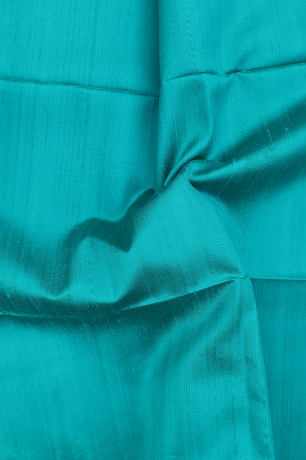 Raw Silk Saree In Plain Peacock Green With Bavanchi Border