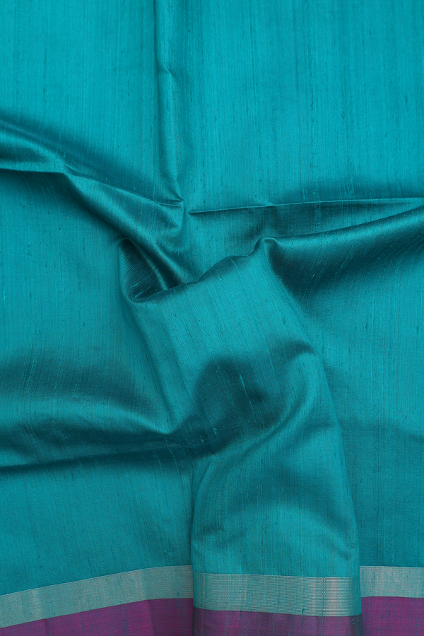 Raw Silk Saree In Plain Peacock Green With Contrast Border