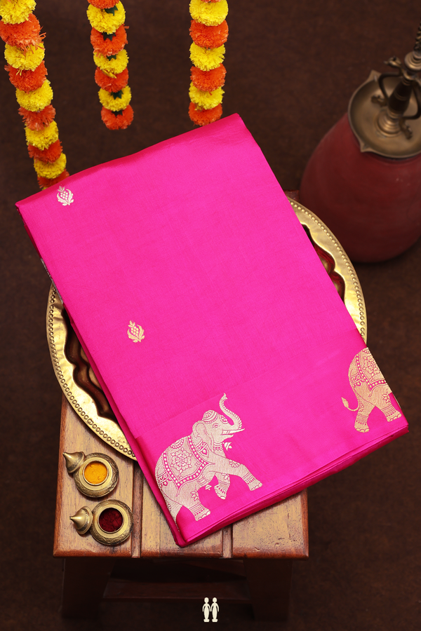 Raw Silk Saree In Rani Pink With Floral Buttas