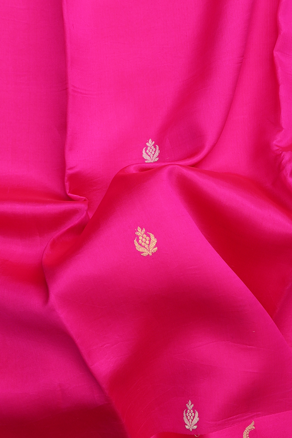 Raw Silk Saree In Rani Pink With Floral Buttas