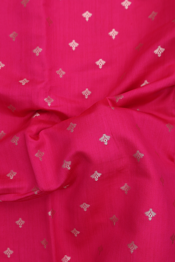 Raw Silk Saree In Rani Pink With Zari Buttas