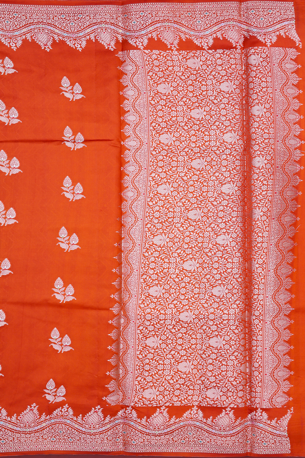 Raw Silk Saree In Rust Orange With Floral Buttas