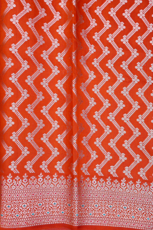 Raw Silk Saree In Rust Orange With Floral Buttas