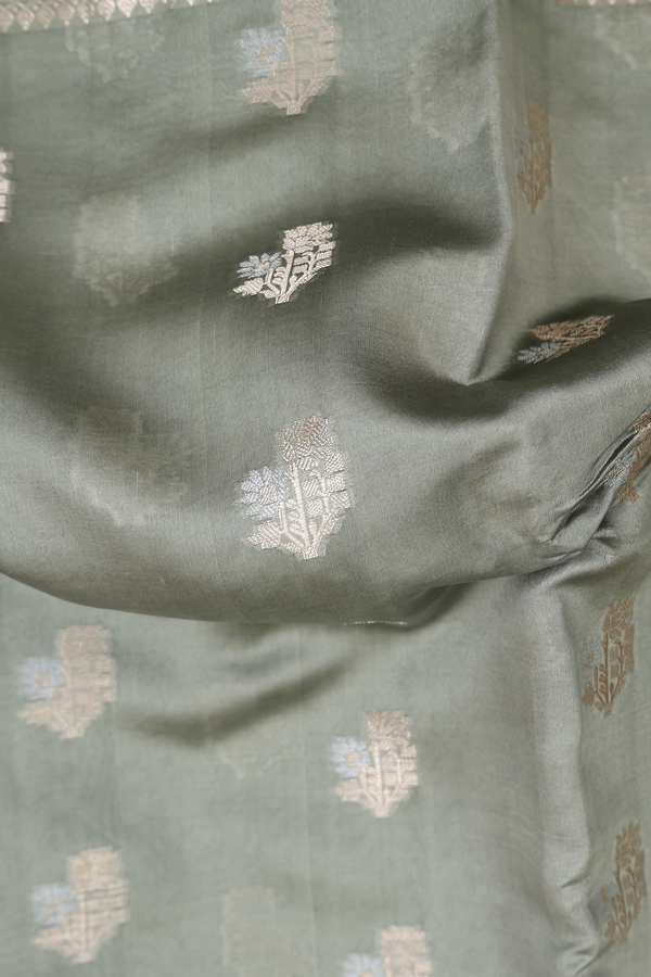 Raw Silk Saree In Sage Green With Floral Buttas