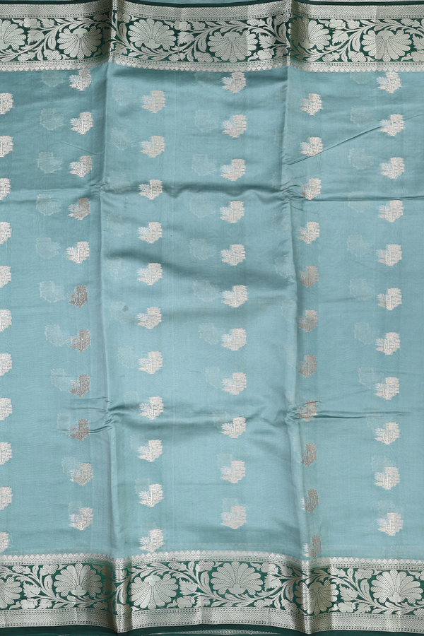 Raw Silk Saree In Turkish Blue With Floral Buttas