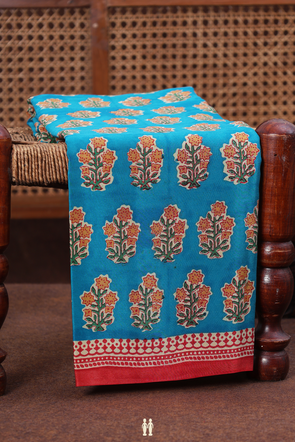 Crepe Saree In Peacock Blue With Floral Printed Design