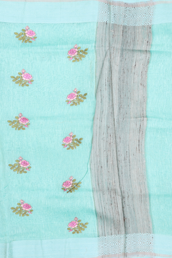 Linen Saree In Sea Green With Floral Embroidered Buttas