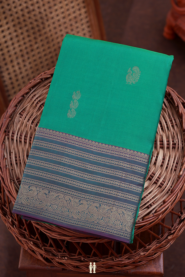Kanchipuram Silk Saree In Green With Peacock Buttas