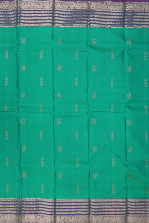 Kanchipuram Silk Saree In Green With Peacock Buttas
