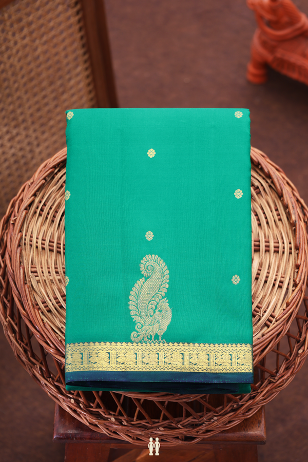 Kanchipuram Silk Saree In Emerald Green With Floral Buttis