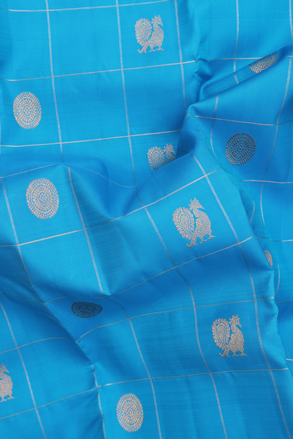 Kanchipuram Silk Saree In Blue Along Checks With Buttas