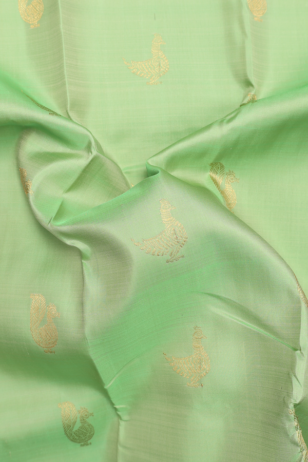 Kanchipuram Silk Saree In Pastel Green With Peacock Buttas
