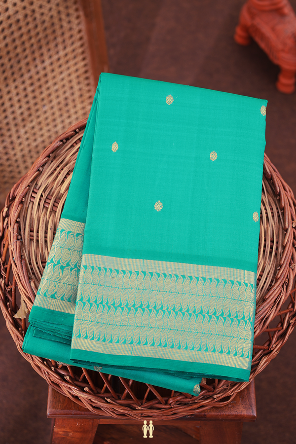 Kanchipuram Silk Saree In Peacock Green With Floral Buttis