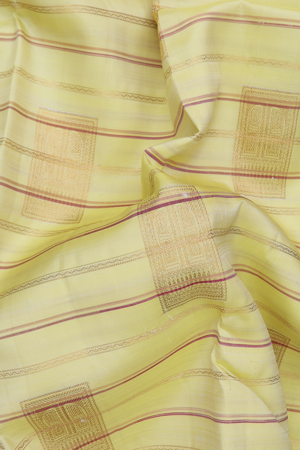 Kanchipuram Silk Saree In Light Yellow With Stripes Design