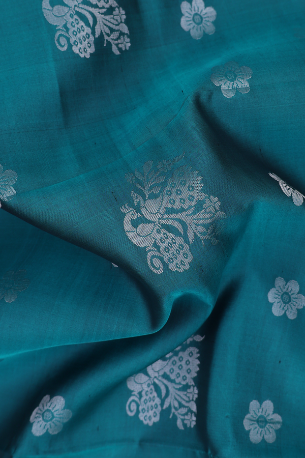 Soft Silk Saree In Teal Blue With Peacock Motifs