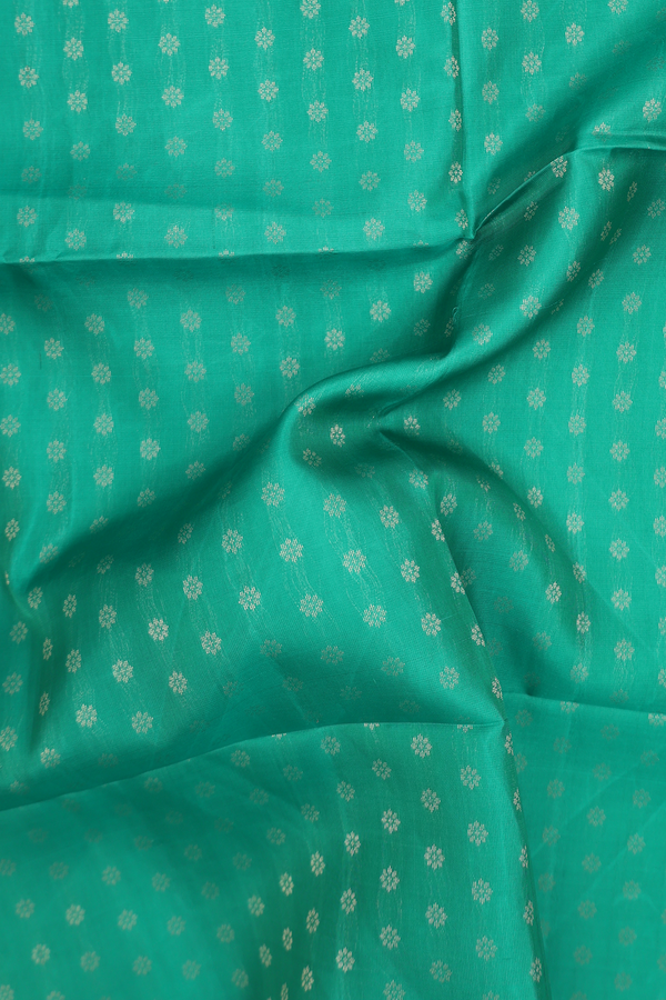 Soft Silk Saree In Green With Floral Buttas