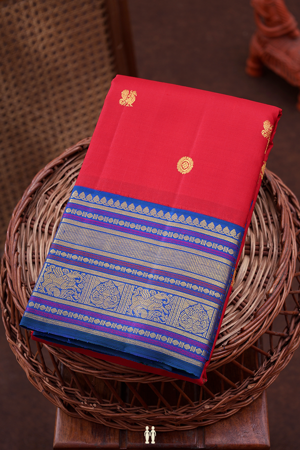 Kanchipuram Silk Saree In Scarlet Red With Peacock Buttas