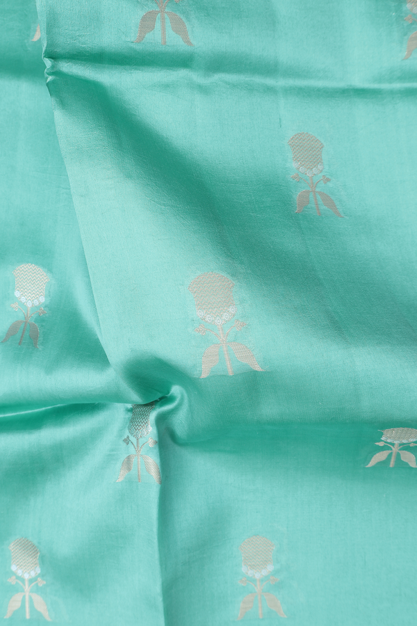 Raw Silk Saree In Tiffany Blue With Floral Buttas