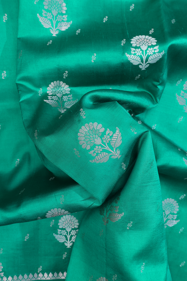 Raw Silk Saree In Sea Green With Floral Buttas