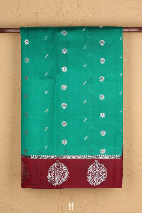 Raw Silk Saree In Green With Floral Buttas