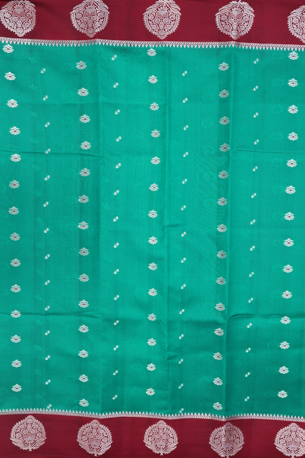 Raw Silk Saree In Green With Floral Buttas