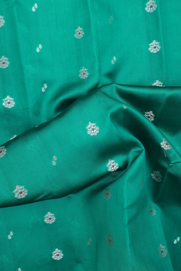 Raw Silk Saree In Green With Floral Buttas