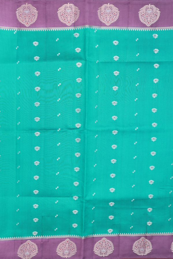 Raw Silk Saree In Peacock Green With Floral Buttas