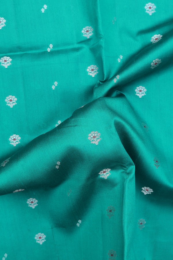 Raw Silk Saree In Peacock Green With Floral Buttas