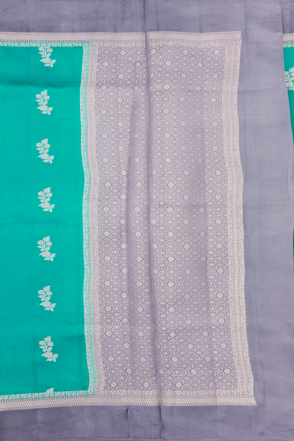 Raw Silk Saree In Sea Green With Floral Buttas