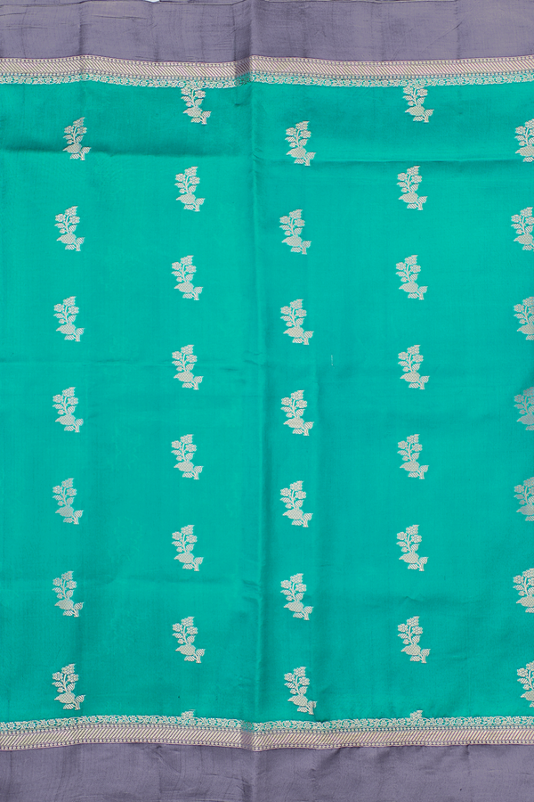Raw Silk Saree In Sea Green With Floral Buttas