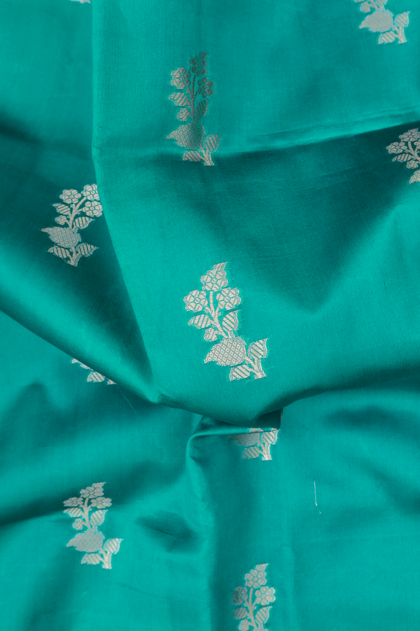 Raw Silk Saree In Sea Green With Floral Buttas